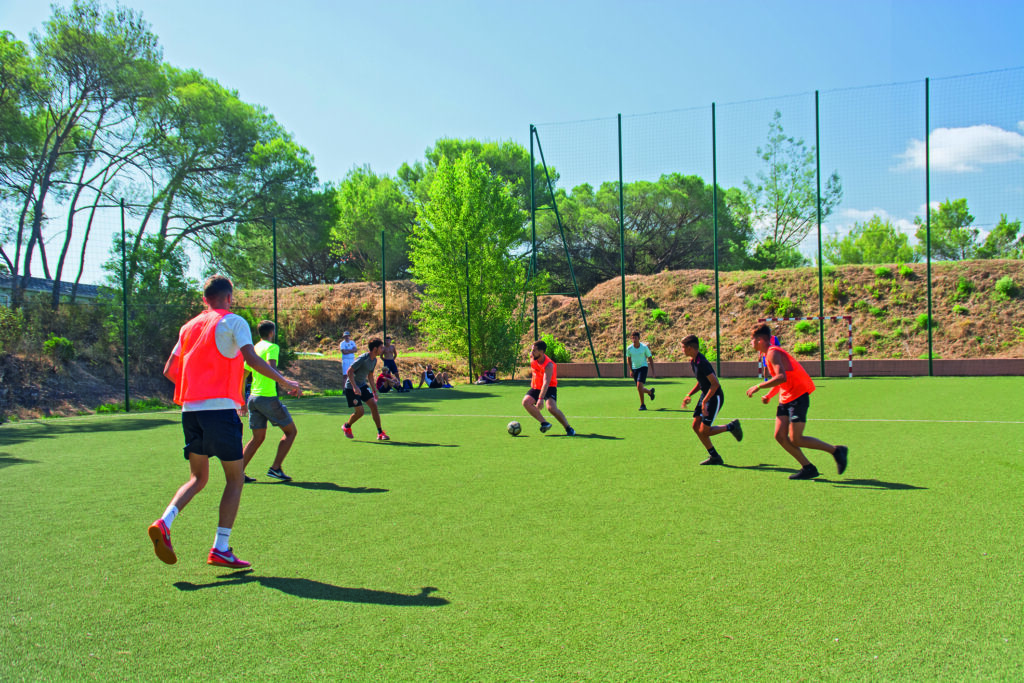 A football match on the UrbanFoot synthetic turf pitch at Oasis Village in Puget-sur-Argens